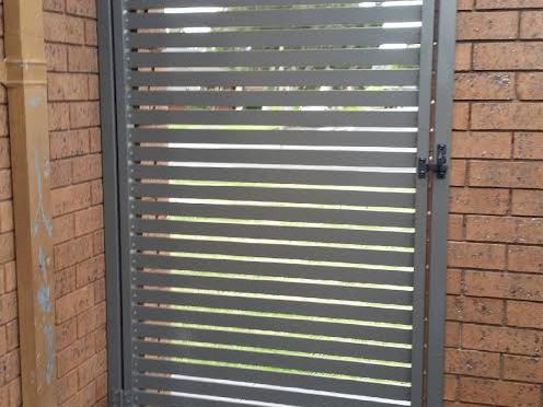 Aluminium slat gate we installed – same slat profile used vertically